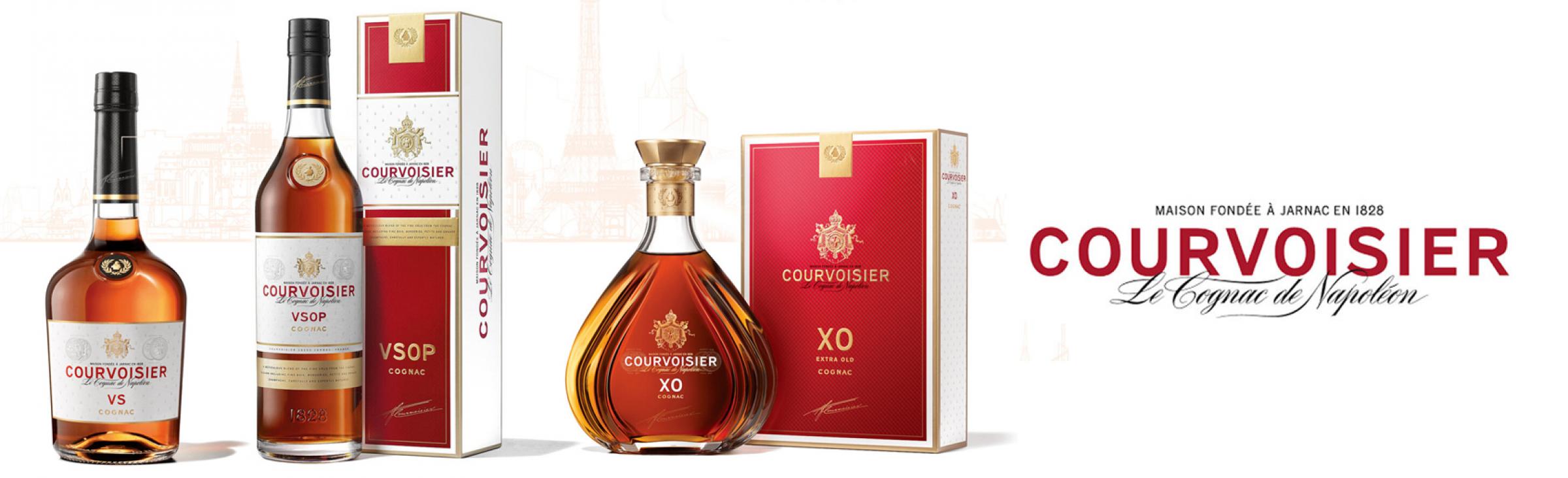 Four bottles of Courvoisier cognac (VS, VSOP, XO, and XO in a decanter) with matching red and gold boxes, and the Courvoisier logo and slogan Le Cognac de Napoléon displayed on the right.